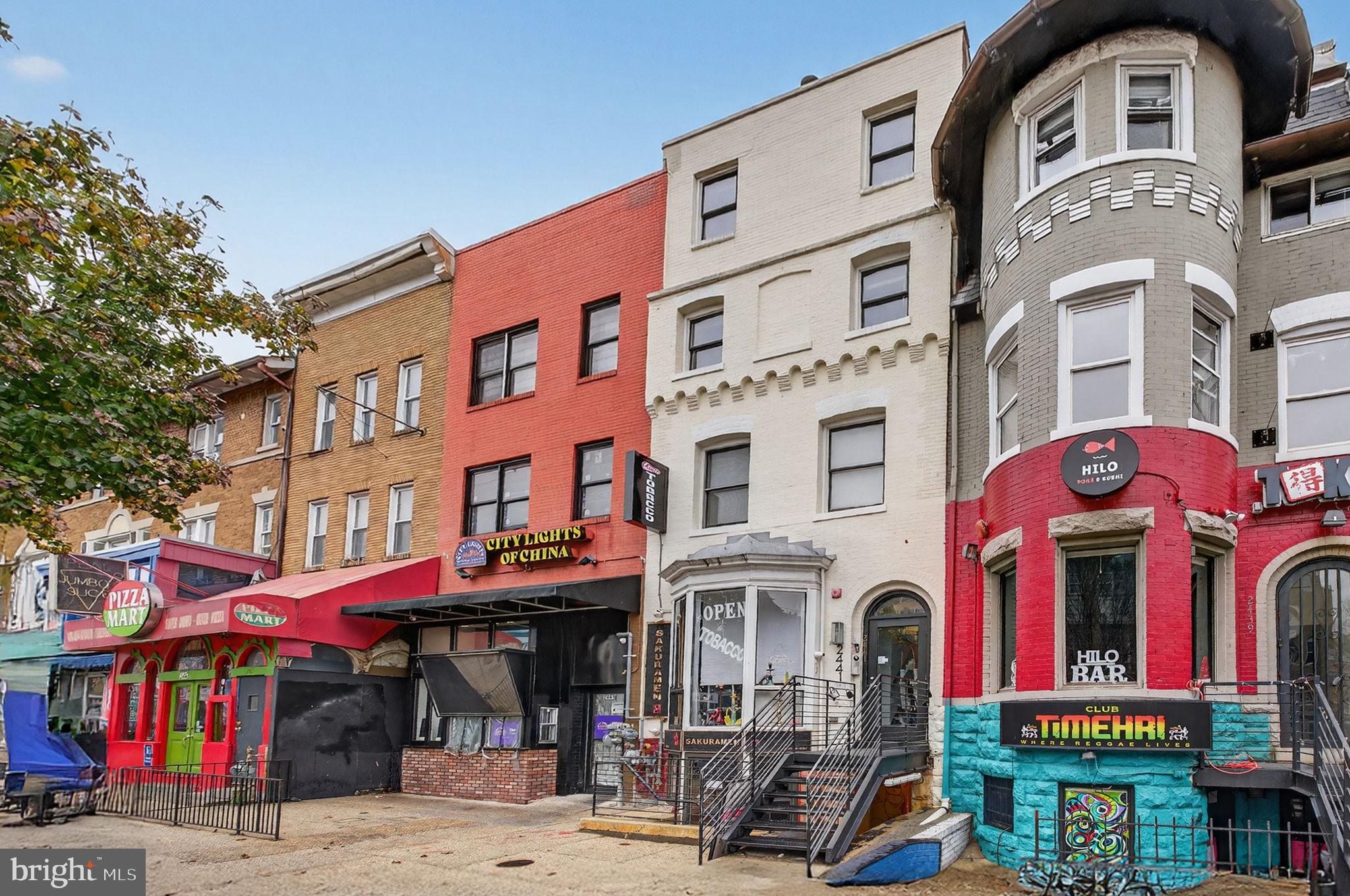 2441 18th Street Northwest, Unit 5 Washington, DC 20009 - Photo 3 of 23 a front view of multi story commercial building with retail shops