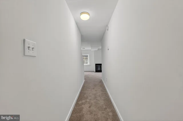 a view of a hallway with a white walls
