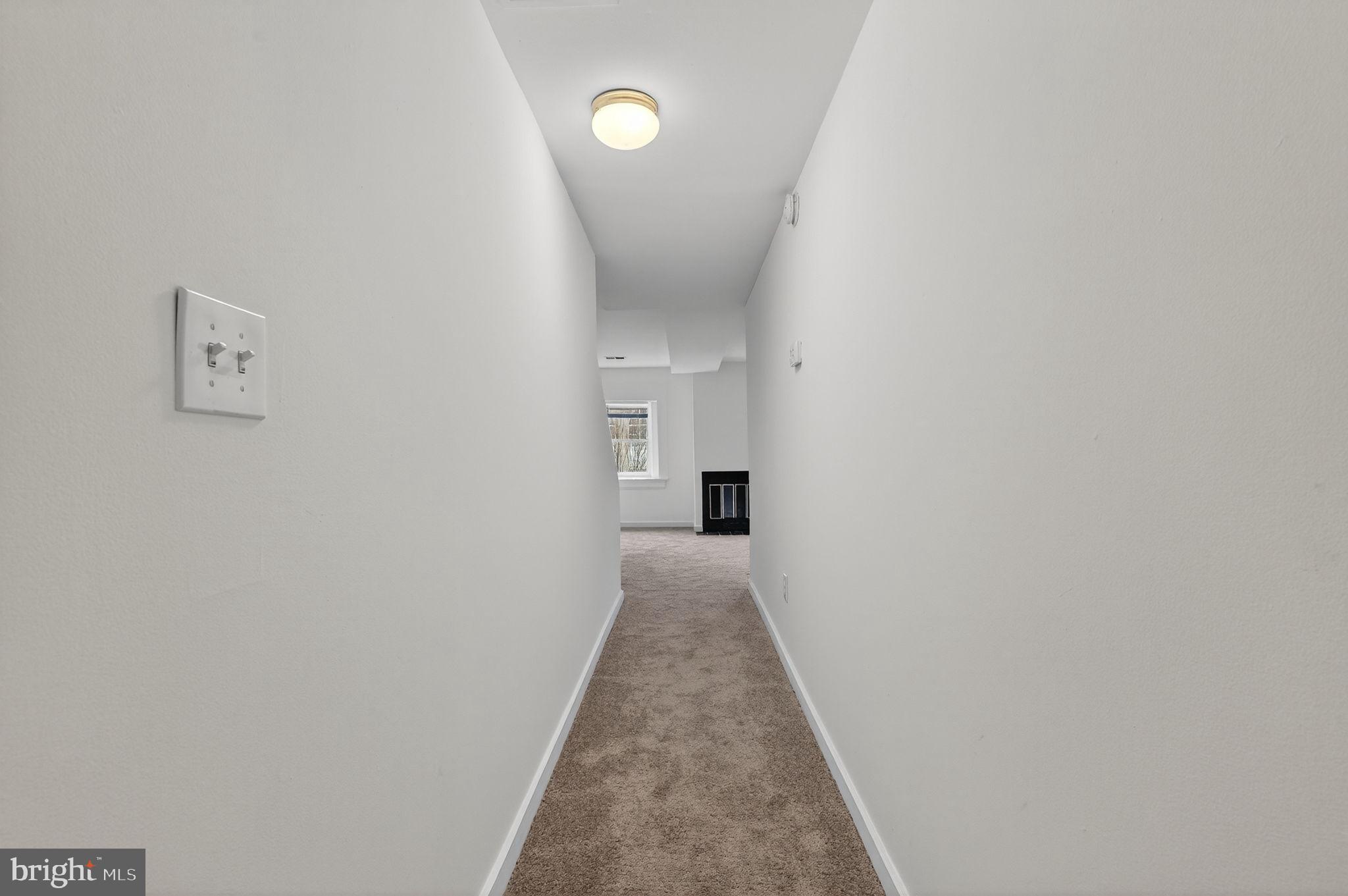 2441 18th Street Northwest, Unit 5 Washington, DC 20009 - Photo 5 of 23 a view of a hallway with a white walls