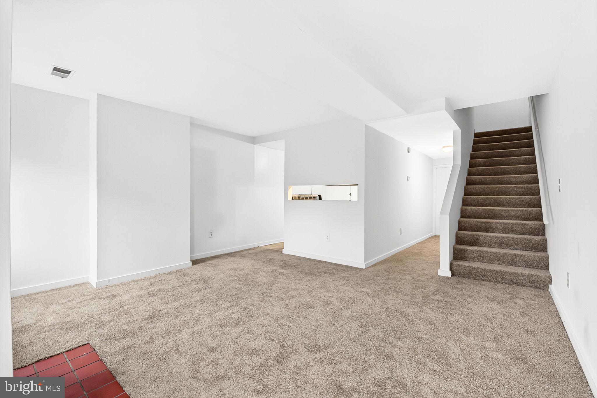2441 18th Street Northwest, Unit 5 Washington, DC 20009 - Photo 8 of 23 a view of an empty room with stairs