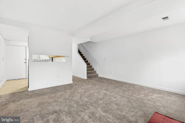 a kitchen with granite countertop cabinets stainless steel appliances and a sink