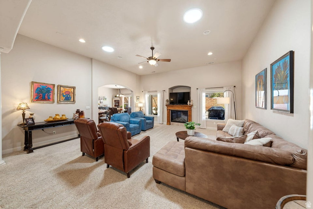 1609 East 10 S Street St. George, UT 84790 - Photo 13 of 68 Spacious living area featuring vaulted ceilings, recessed lighting, and a neutral carpeted floor