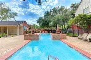2211 South Kirkwood Road, Unit 28 Houston, TX 77077 - Photo 9 of 9 a swimming pool with outdoor seating and yard