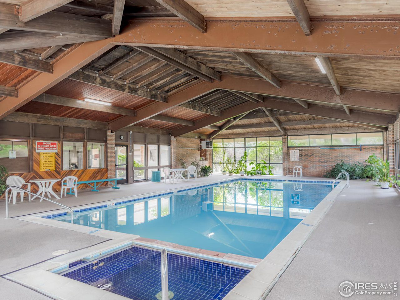 5116 Williams Fork Trail, Unit 103 Boulder, CO 80301 - Photo 13 of 20 a view of a swimming pool with a patio