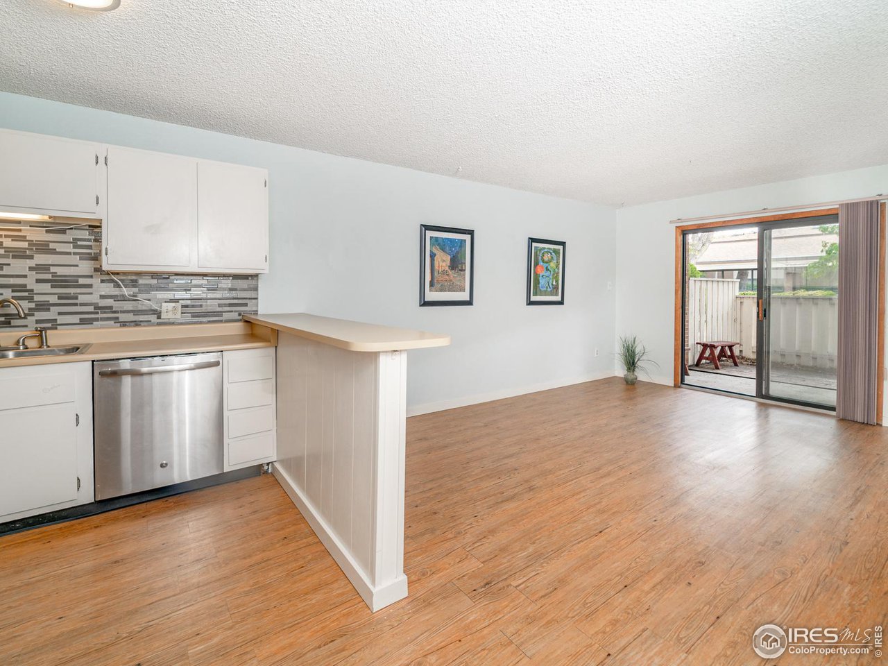 5116 Williams Fork Trail, Unit 103 Boulder, CO 80301 - Photo 8 of 20 a view of a kitchen with wooden floor and electronic appliances