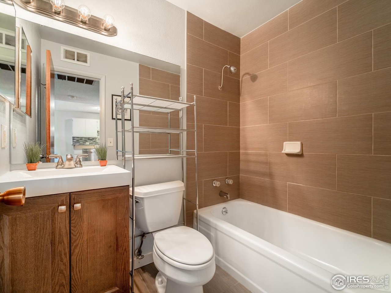 5116 Williams Fork Trail, Unit 103 Boulder, CO 80301 - Photo 9 of 20 a bathroom with a sink a toilet and shower