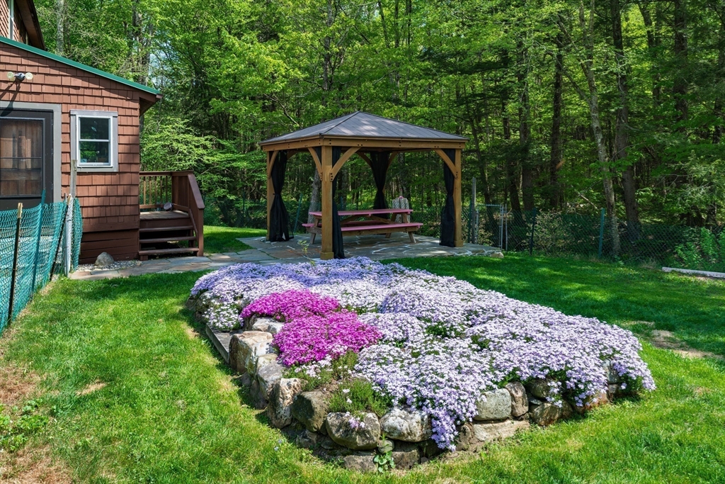 425 Dingle Road Worthington, MA 01098 - Photo 25 of 32 a view of a backyard with a garden and swimming pool