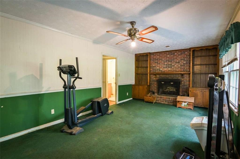 17 Valley Trail Covington, GA 30014 - Photo 7 of 19 a living room with furniture and a fireplace
