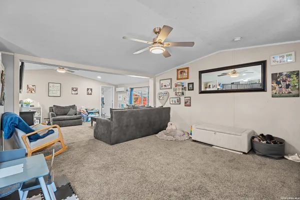a kitchen with stainless steel appliances kitchen island granite countertop a refrigerator and cabinets