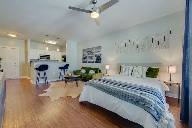 a bedroom with a bed and window