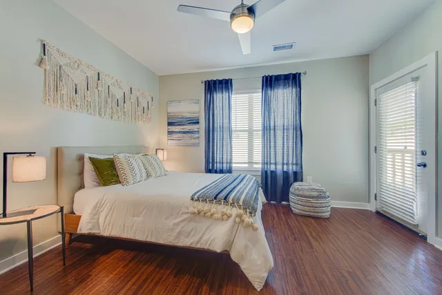 a view of living room with furniture and wooden floor