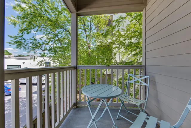 a view of balcony with wooden floor