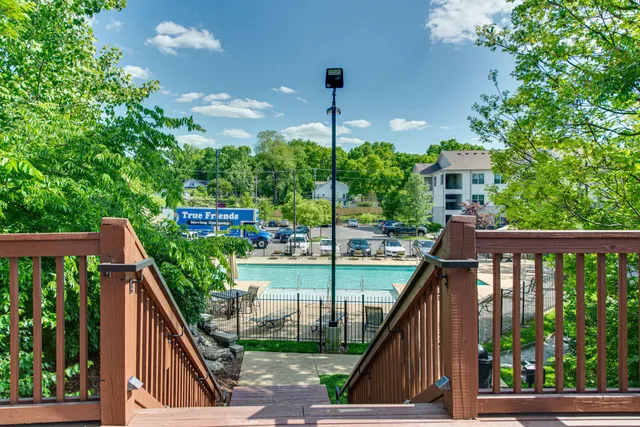 a living room with fireplace furniture and a flat screen tv