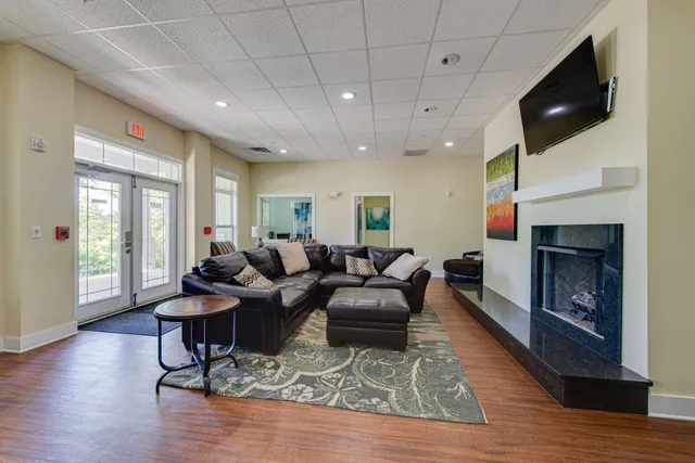 a living room with furniture and a rug
