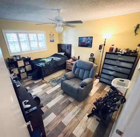 a bathroom with a sink mirror and toilet