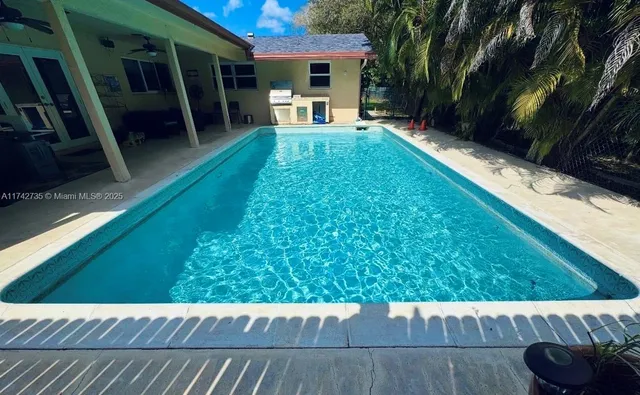 a view of a back yard of the house