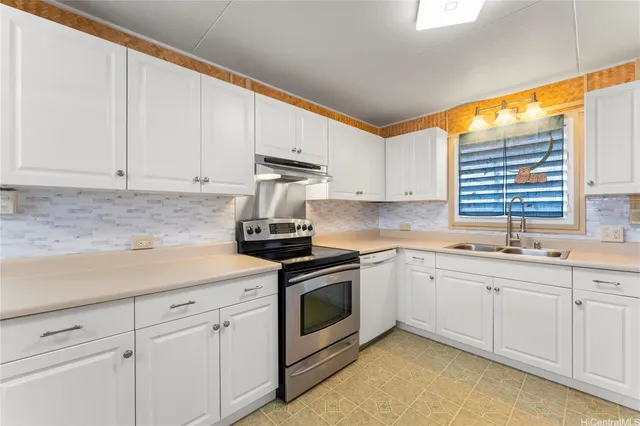 a kitchen with white cabinets and white appliances