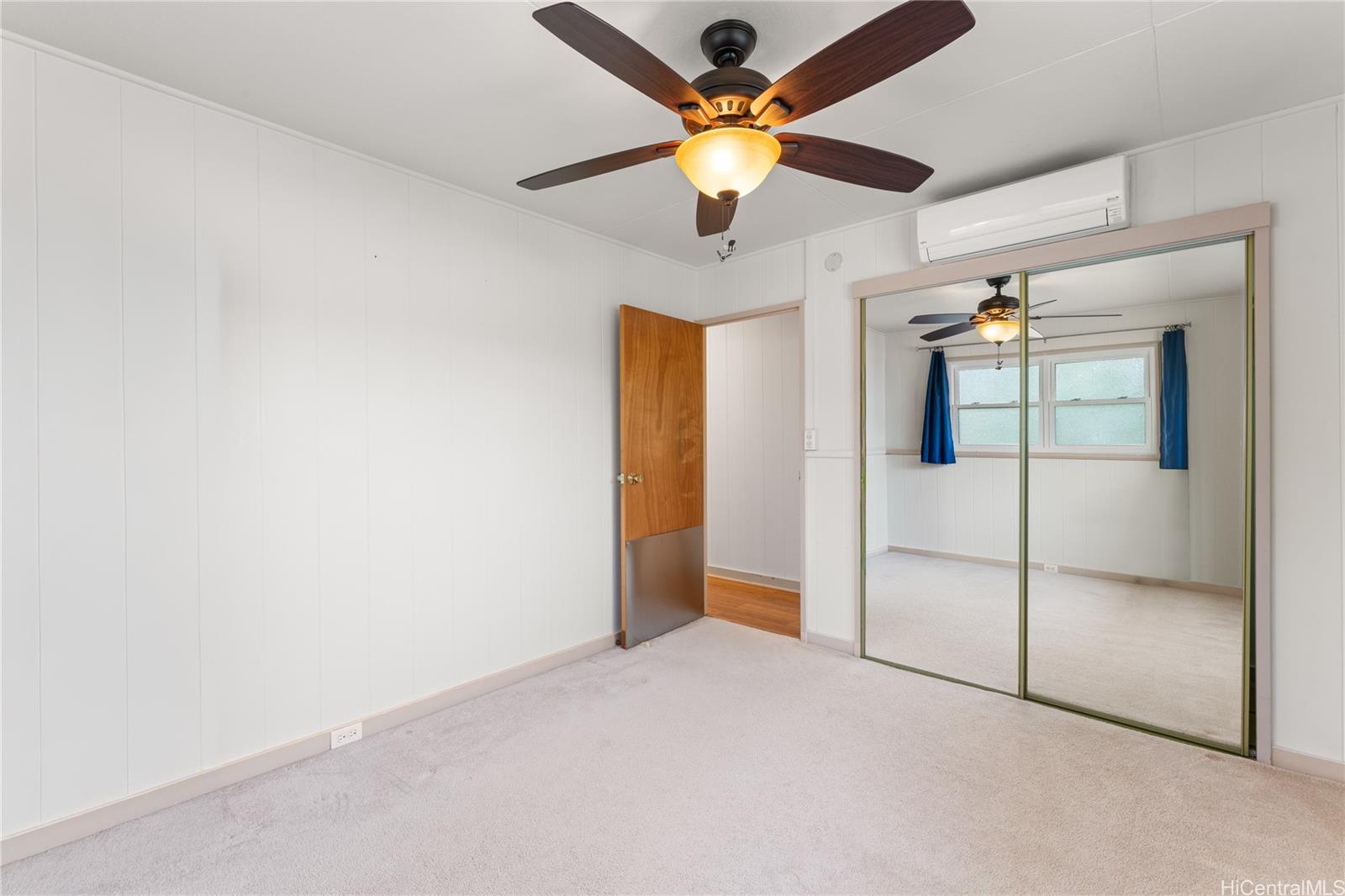 2915 Koali Road, Unit C Honolulu, HI 96826 - Photo 17 of 24 en empty room with fan and ceiling fan