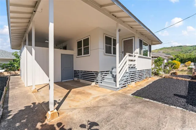 a view of a house with wooden fence
