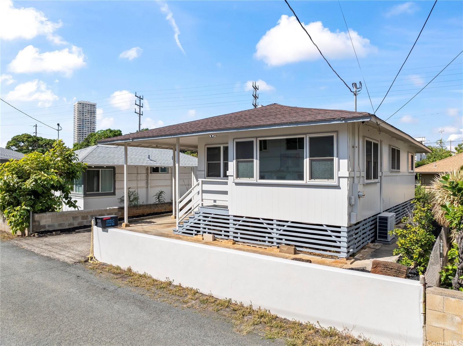 2915 Koali Road, Unit C Honolulu, HI 96826 - Photo 23 of 24 a front view of a house with a garage