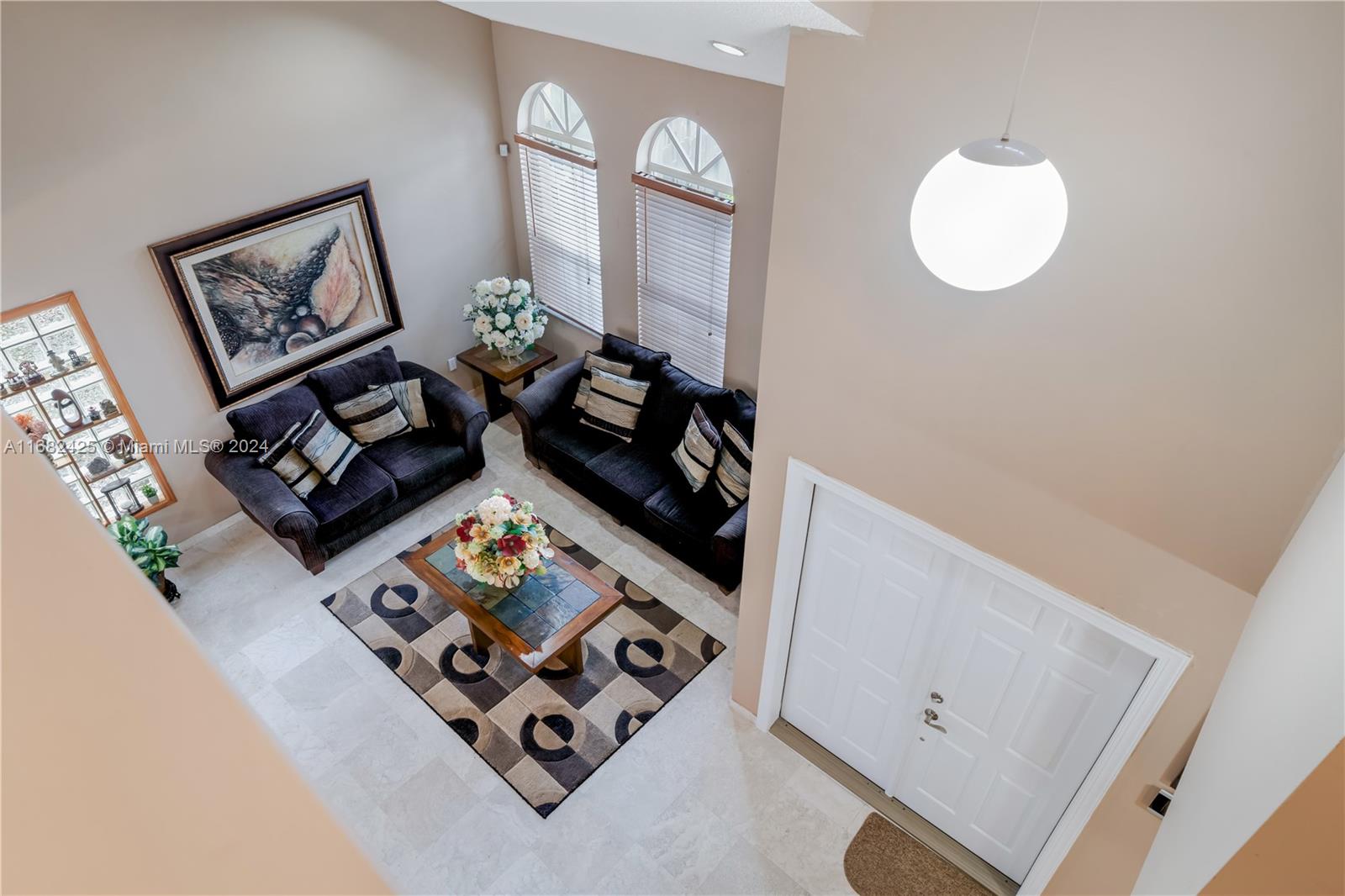 16358 Southwest 82nd Terrace Miami, FL 33193 - Photo 18 of 37 wooden floor with white walls and view of living room