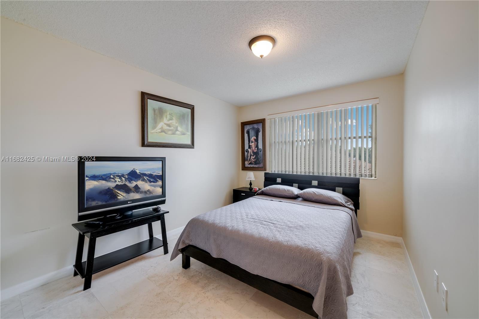 16358 Southwest 82nd Terrace Miami, FL 33193 - Photo 28 of 37 a bedroom with a bed and a dresser next to it