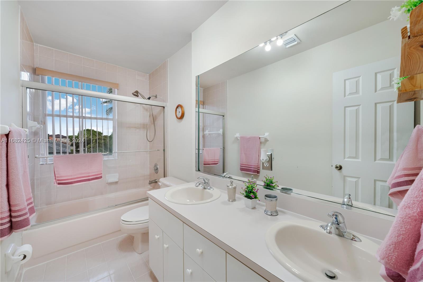 16358 Southwest 82nd Terrace Miami, FL 33193 - Photo 29 of 37 a bathroom with a sink a toilet a tub and shower