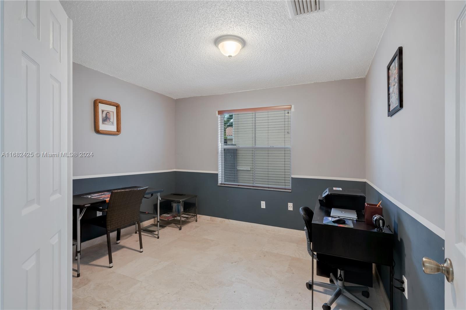 16358 Southwest 82nd Terrace Miami, FL 33193 - Photo 30 of 37 a bedroom with a workspace