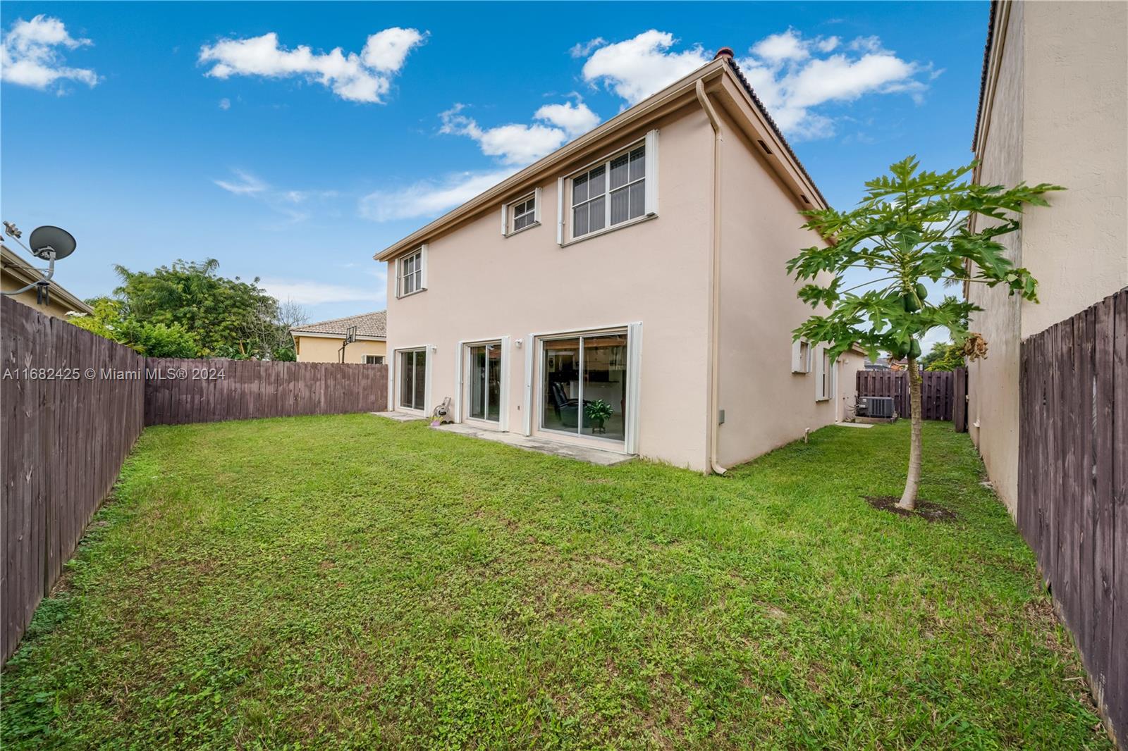 16358 Southwest 82nd Terrace Miami, FL 33193 - Photo 35 of 37 a view of an house with backyard space and garden