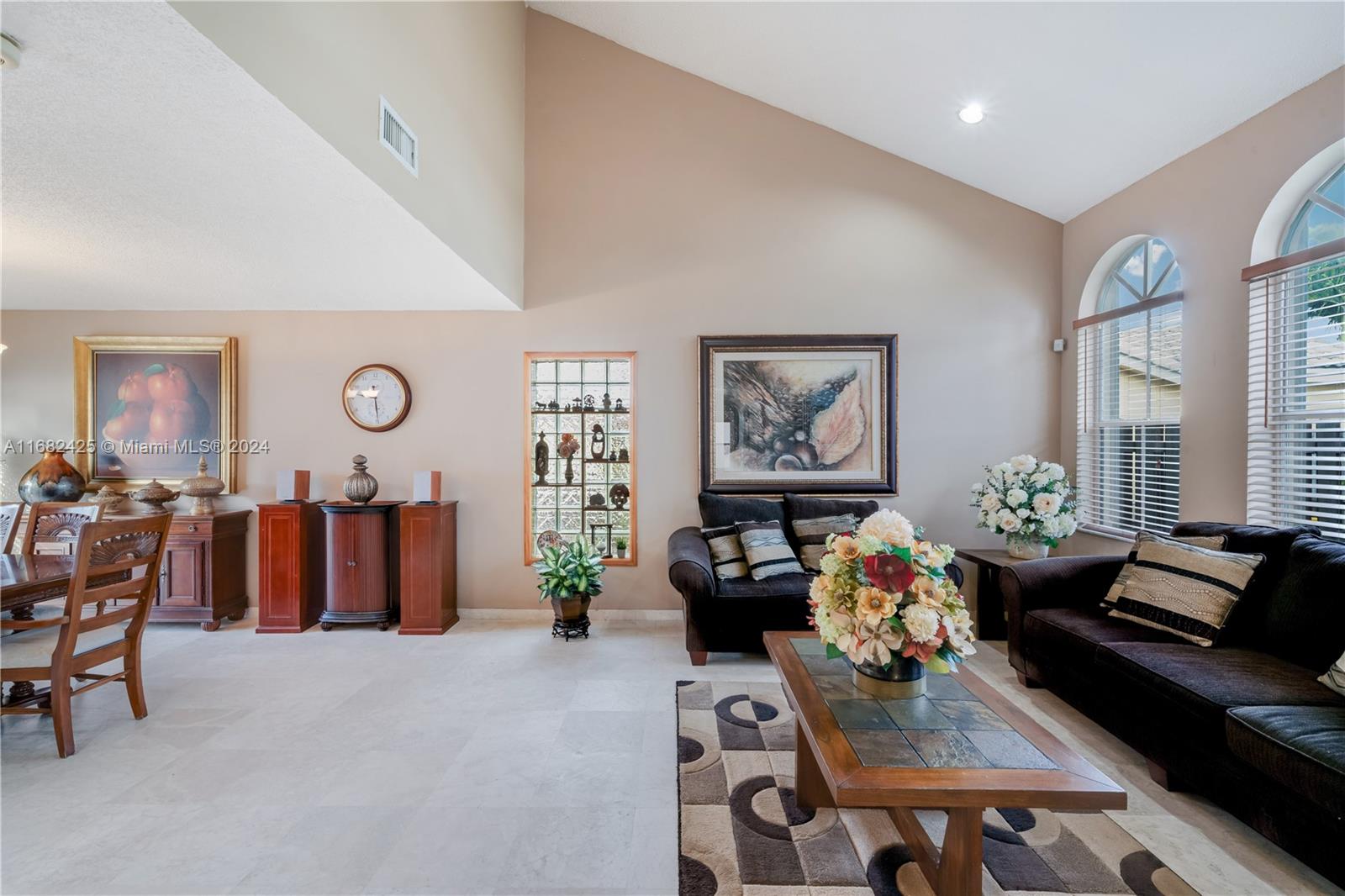 16358 Southwest 82nd Terrace Miami, FL 33193 - Photo 6 of 37 a living room with furniture and a large window