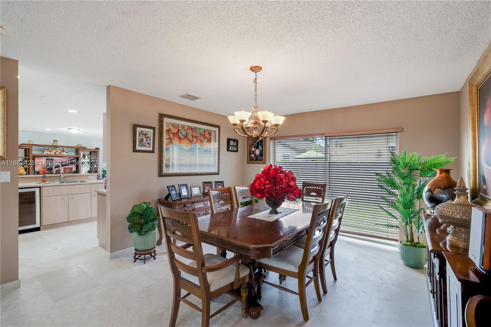 16358 Southwest 82nd Terrace Miami, FL 33193 - Photo 9 of 37 a view of a dining room with furniture and chandelier