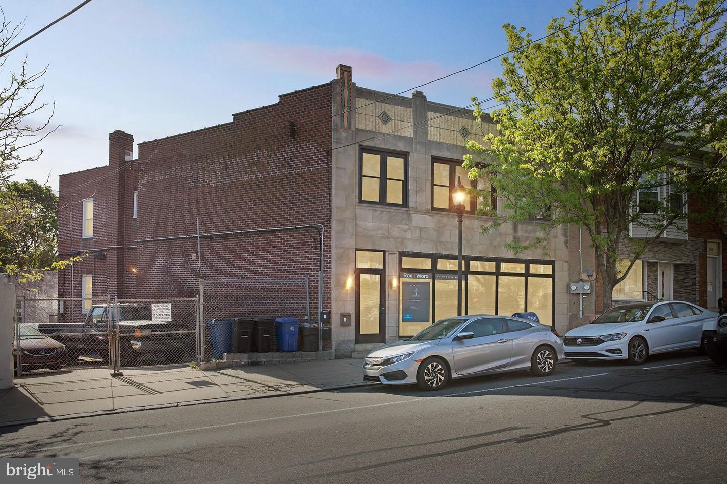 a view of a car parked in front of a building