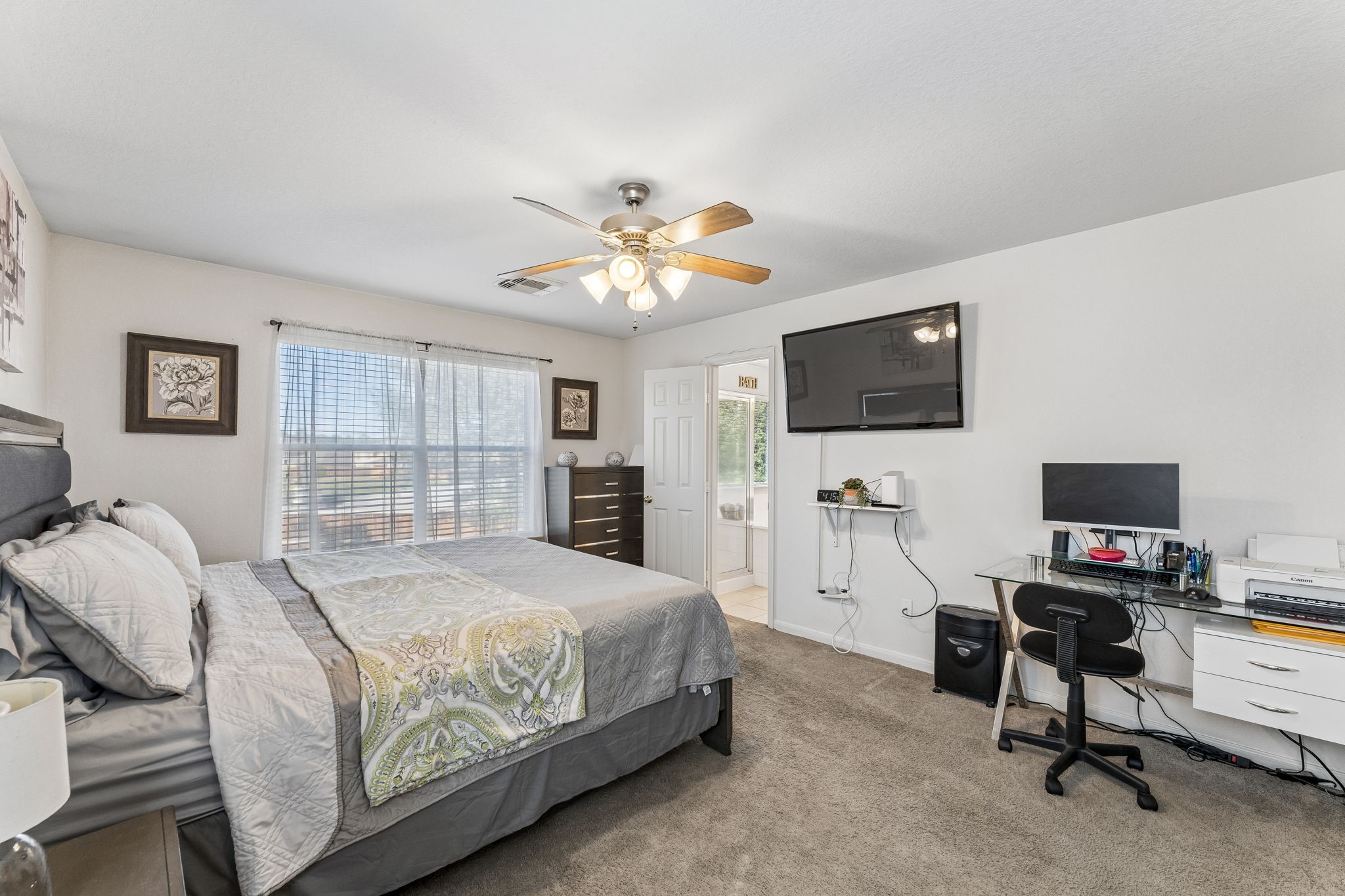 3203 Falcon Trail Drive Spring, TX 77373 - Photo 16 of 33 Generous primary suite with plenty of room for a king-size bed, additional furniture and even a dedicated workspace.