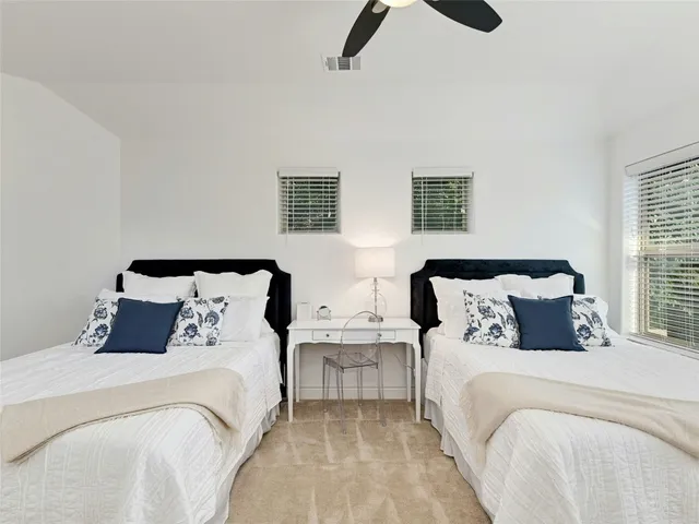 a bedroom with double bed and a night stand