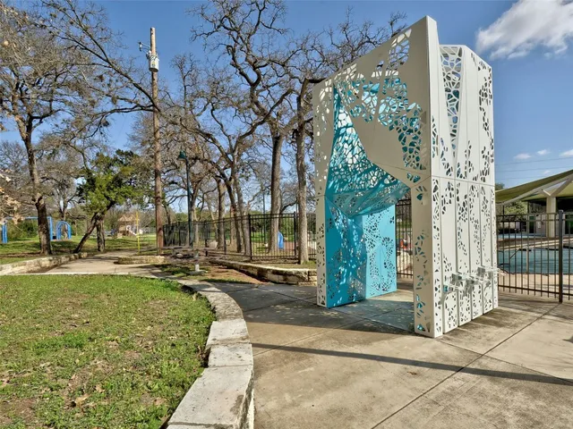 a view of a park with large trees