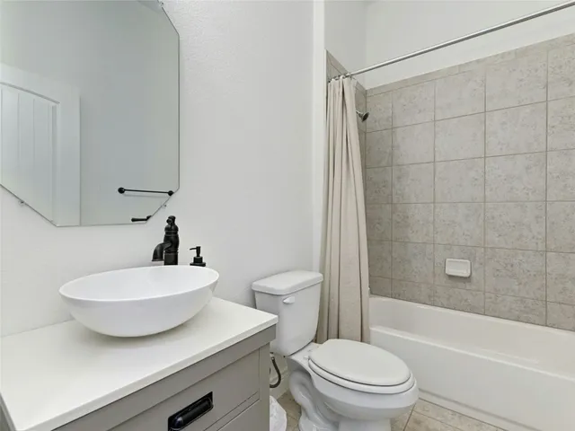 a bathroom with a sink a toilet and a bathtub