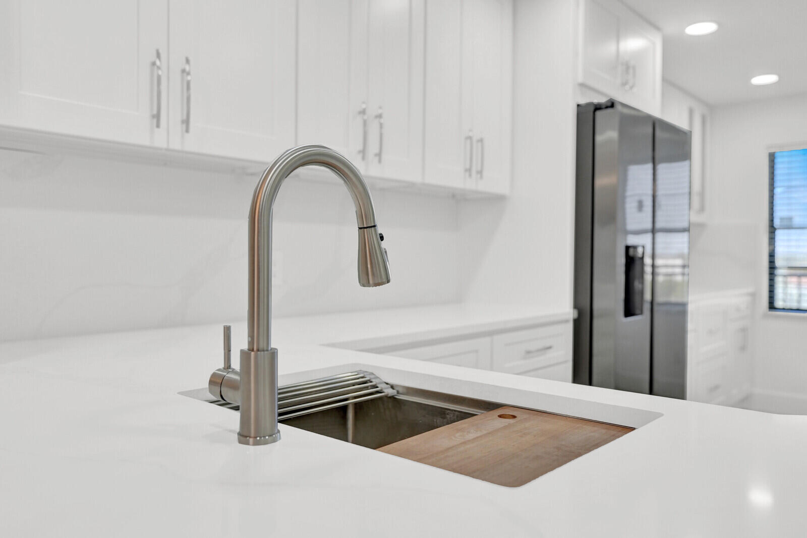 9260 Southwest 14th Street, Unit 2508 Boca Raton, FL 33428 - Photo 14 of 49 a kitchen with a refrigerator and a sink