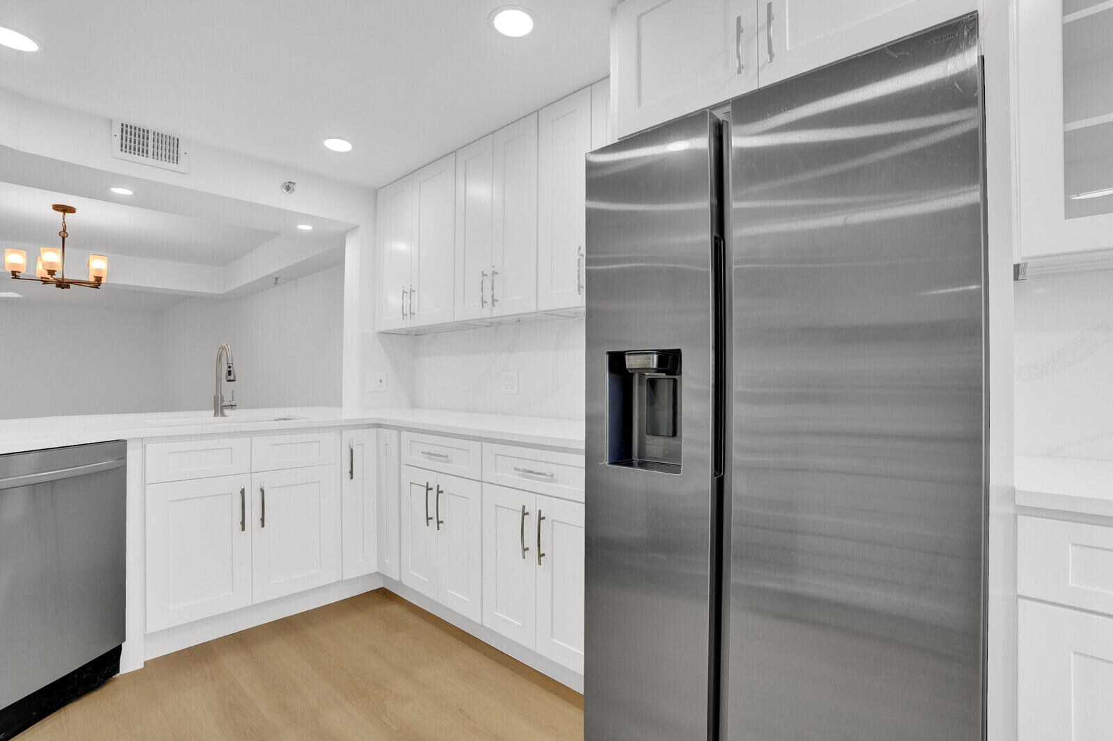 9260 Southwest 14th Street, Unit 2508 Boca Raton, FL 33428 - Photo 17 of 49 a kitchen with cabinets and stainless steel appliances