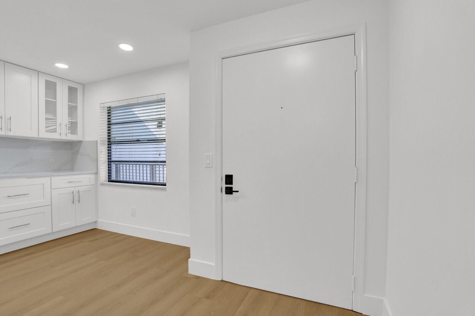 9260 Southwest 14th Street, Unit 2508 Boca Raton, FL 33428 - Photo 2 of 49 a view of an empty room with wooden floor and cabinet