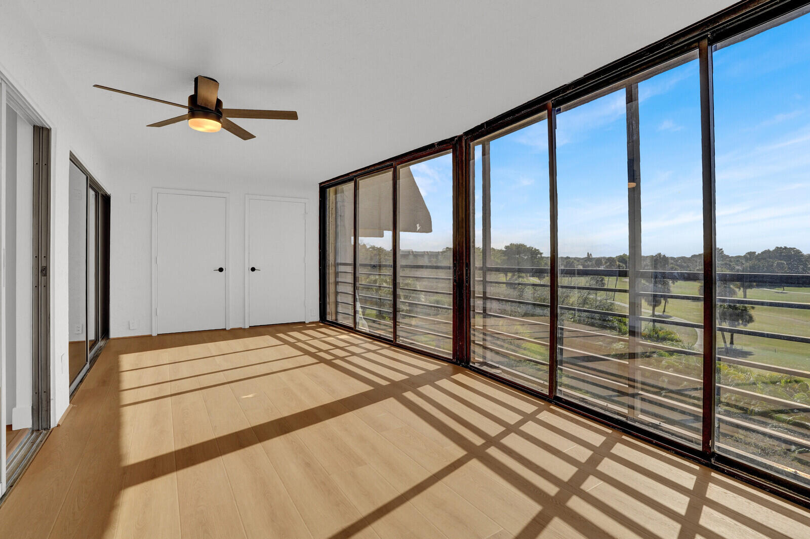 9260 Southwest 14th Street, Unit 2508 Boca Raton, FL 33428 - Photo 38 of 49 a view of a bedroom with wooden floor