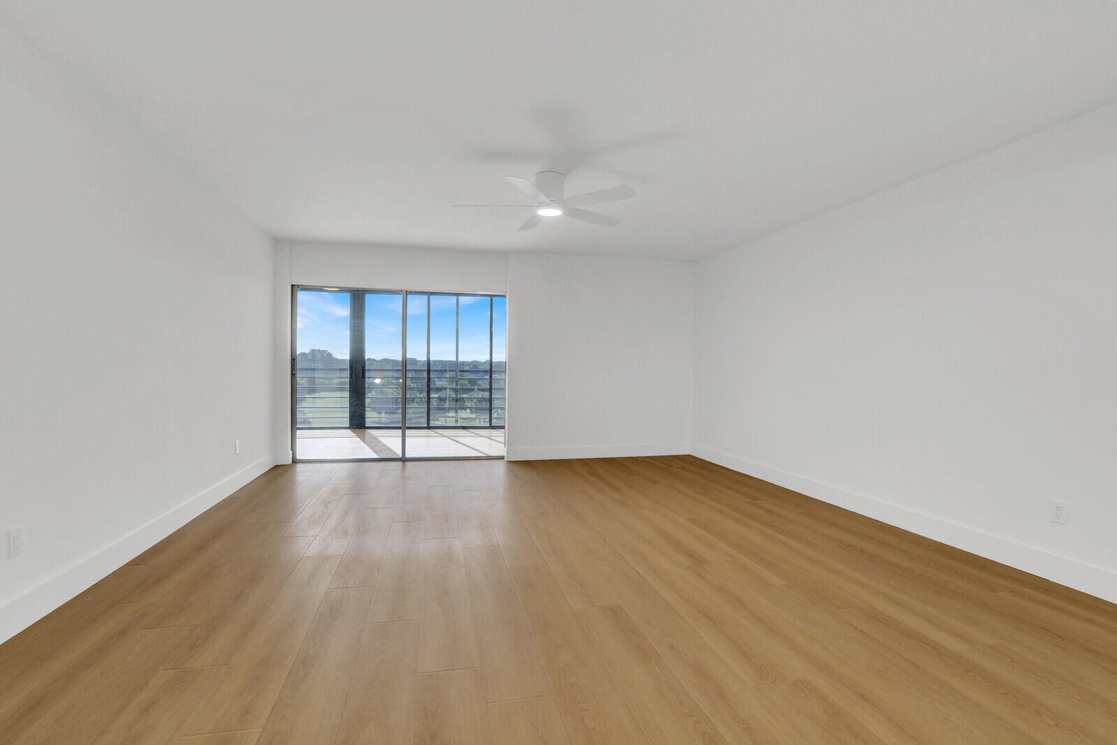 9260 Southwest 14th Street, Unit 2508 Boca Raton, FL 33428 - Photo 5 of 49 wooden floor in an empty room with a window