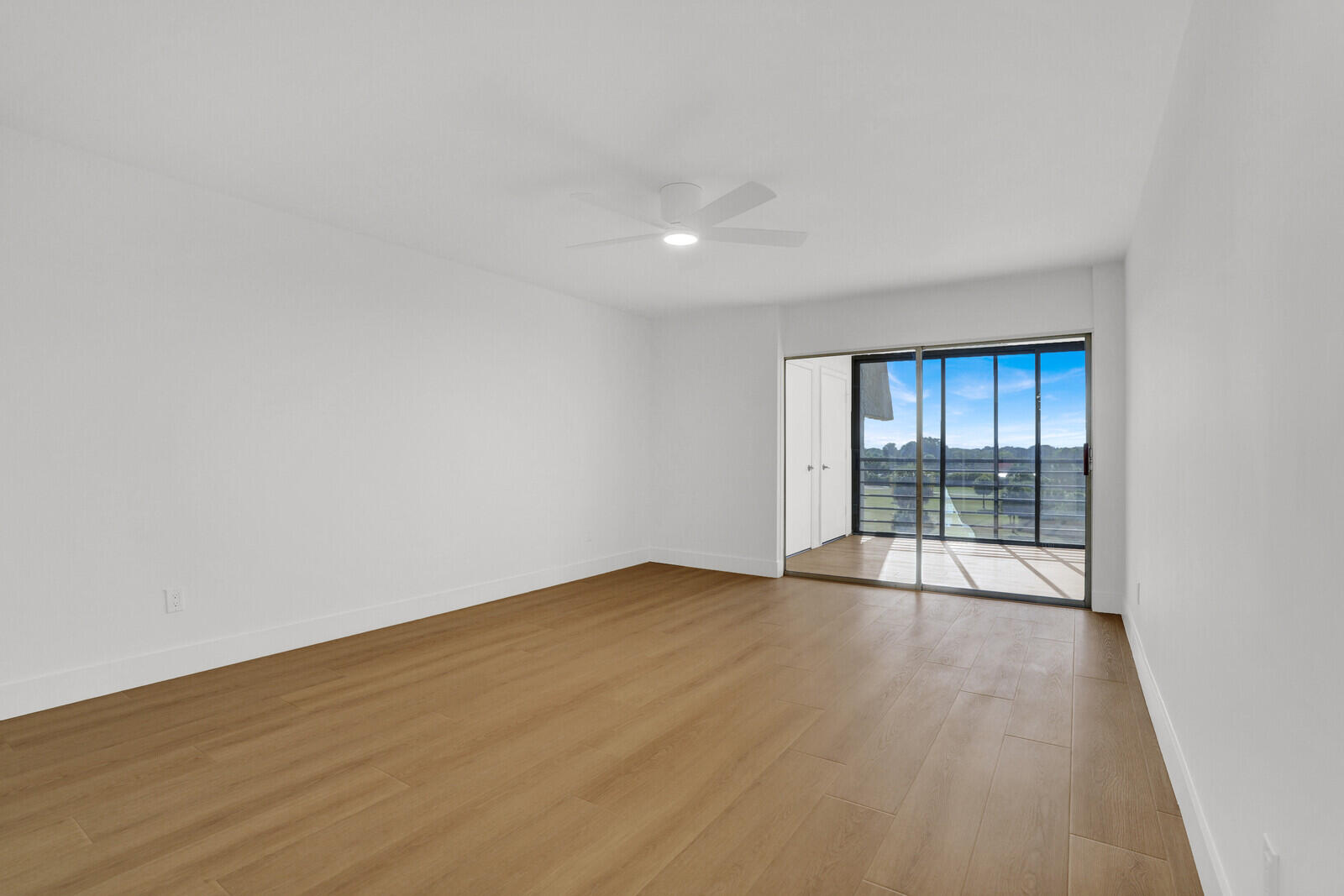 9260 Southwest 14th Street, Unit 2508 Boca Raton, FL 33428 - Photo 8 of 49 wooden floor in an empty room with a window