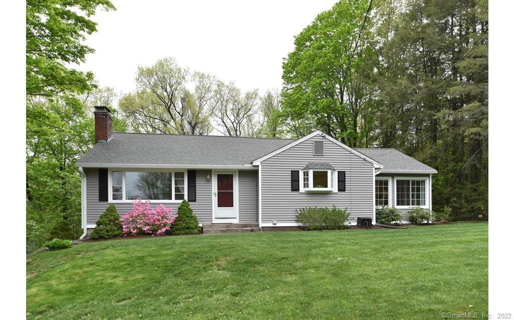 586 Country Club Road Avon, CT 06001 - Photo 1 of 1 a front view of house with yard and green space