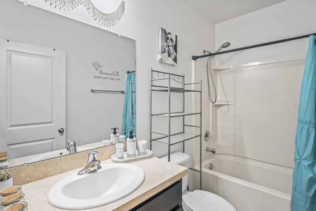 571 Old Windsor Way Spring Hill, FL 34609 - Photo 11 of 61 a bathroom with a sink toilet and shower