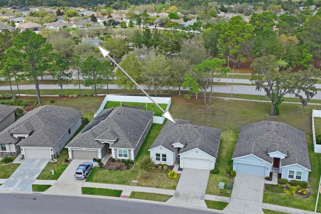 571 Old Windsor Way Spring Hill, FL 34609 - Photo 3 of 61 an aerial view of house with yard