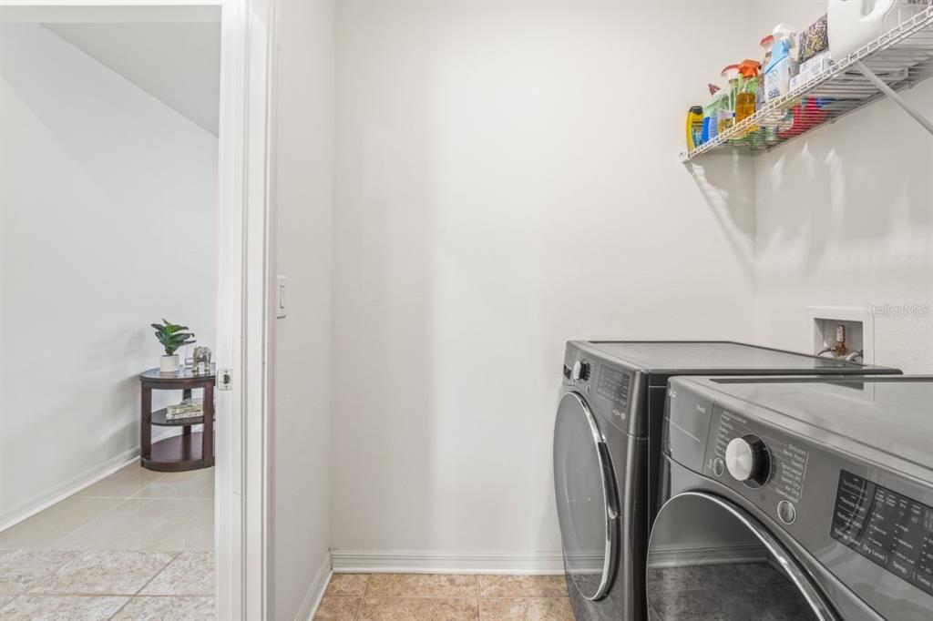 571 Old Windsor Way Spring Hill, FL 34609 - Photo 32 of 61 a utility room with dryer and washer