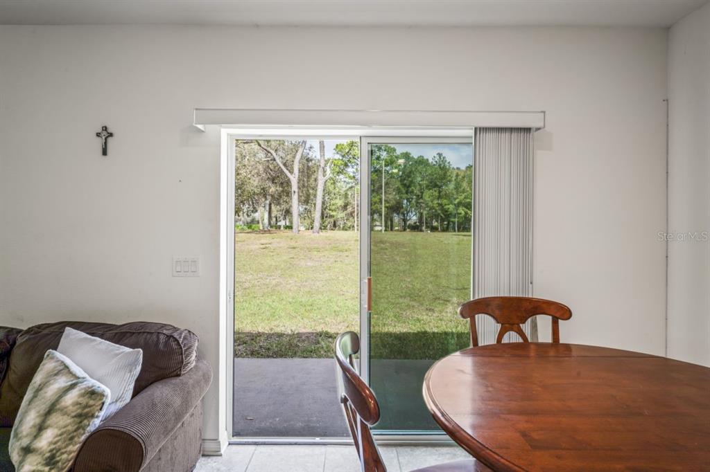 571 Old Windsor Way Spring Hill, FL 34609 - Photo 33 of 61 a view of a bedroom with furniture and window