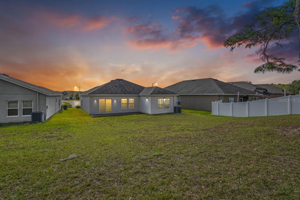 571 Old Windsor Way Spring Hill, FL 34609 - Photo 36 of 61 a view of a house with a yard