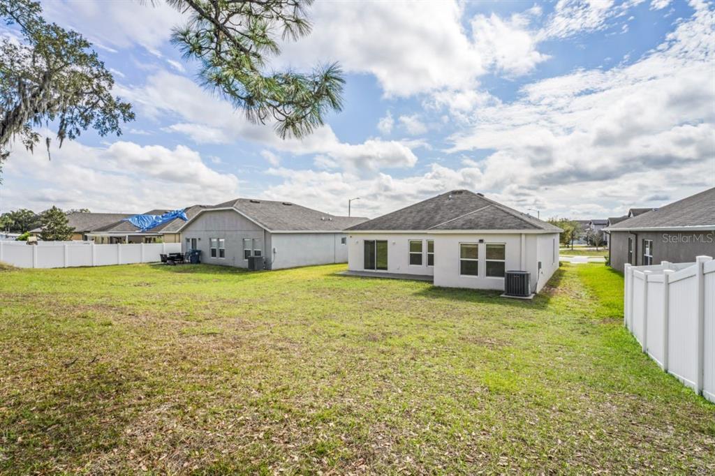 571 Old Windsor Way Spring Hill, FL 34609 - Photo 37 of 61 a front view of a house with garden