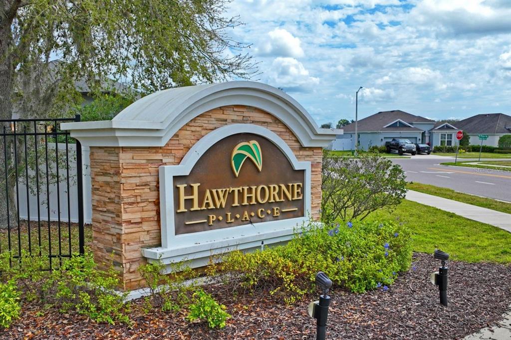 571 Old Windsor Way Spring Hill, FL 34609 - Photo 45 of 61 a sign that is on the side of a road
